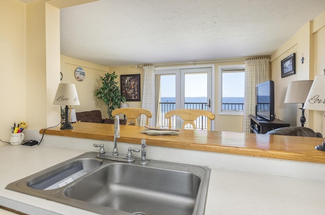 191 E Grand Ave Unit 504, Old Orchard Beach, ME 04064 - kitchen featuring light countertops and a textured ceiling
