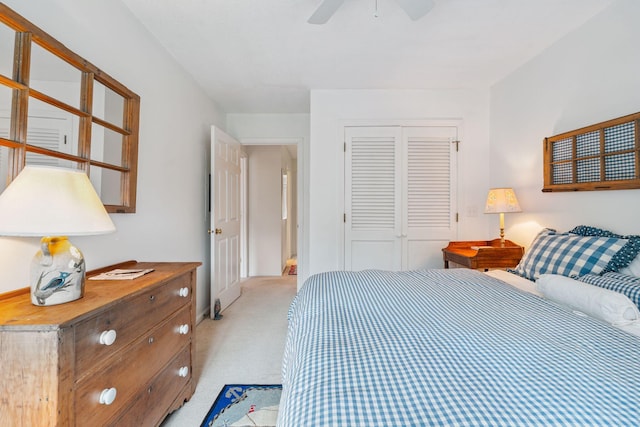 239 Sea Rd Unit 32, Kennebunk, ME 04043 - bedroom featuring light colored carpet, a closet, and a ceiling fan