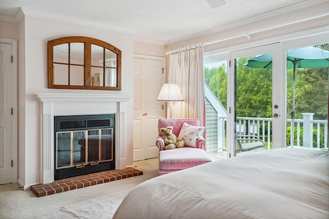 239 Sea Rd Unit 32, Kennebunk, ME 04043 - bedroom featuring access to exterior, crown molding, carpet, and a textured ceiling