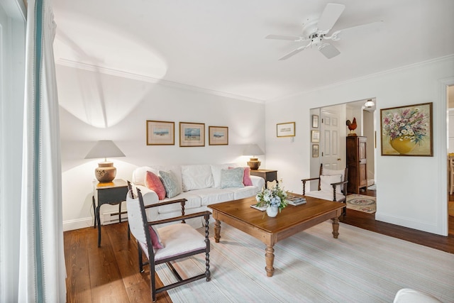 239 Sea Rd Unit 32, Kennebunk, ME 04043 - living room with wood-type flooring, ornamental molding, ceiling fan, and baseboard heating