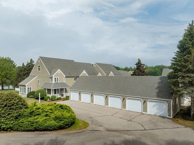 239 Sea Rd Unit 32, Kennebunk, ME 04043 - view of front facade with community garages and a shingled roof