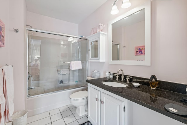 239 Sea Rd Unit 32, Kennebunk, ME 04043 - bathroom with tile patterned flooring, vanity, and bath / shower combo with glass door