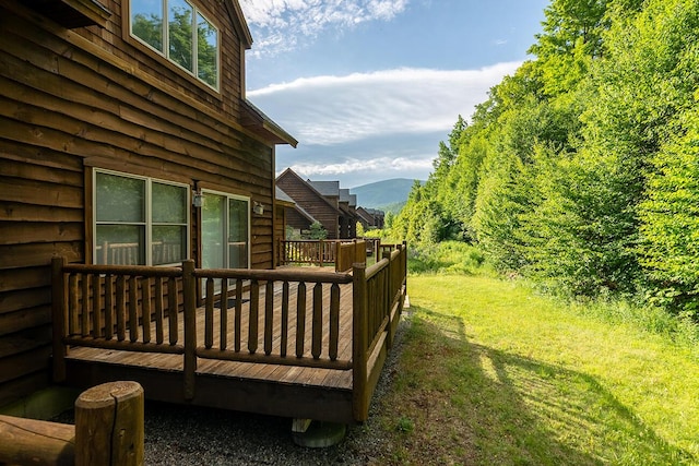 7022 Hardwood Ridge Rd Unit 7022, Carrabassett Valley, ME 04947 - wooden deck with a mountain view and a yard