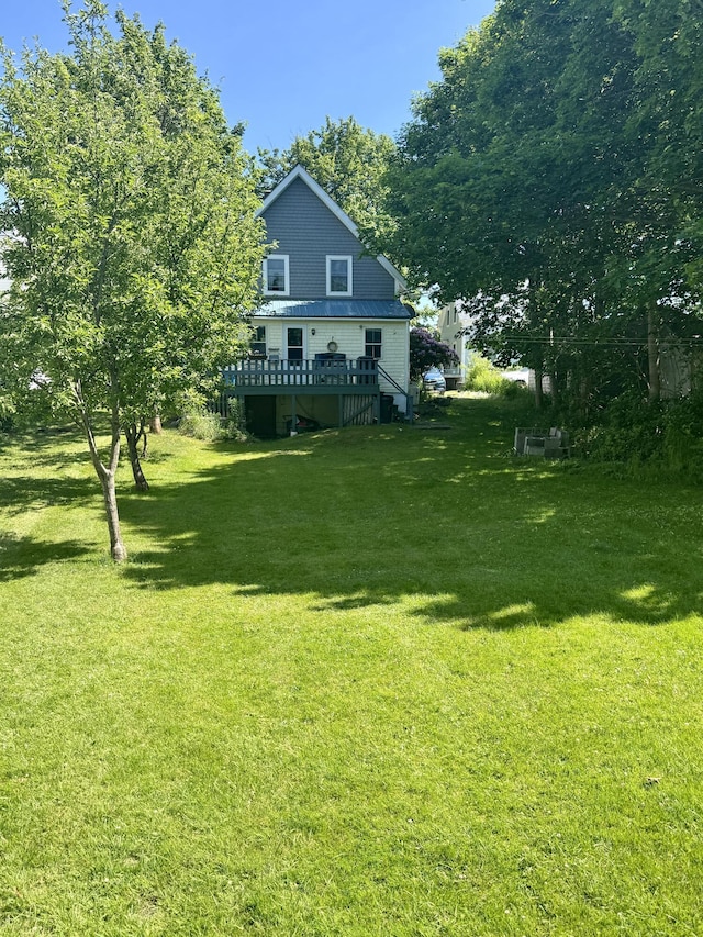 21 Wilson St, Eastport, ME 04631 - view of grassy yard featuring a wooden deck