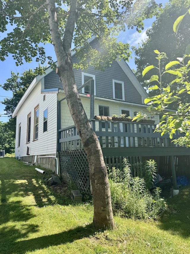 21 Wilson St, Eastport, ME 04631 - back of house with a lawn and a deck