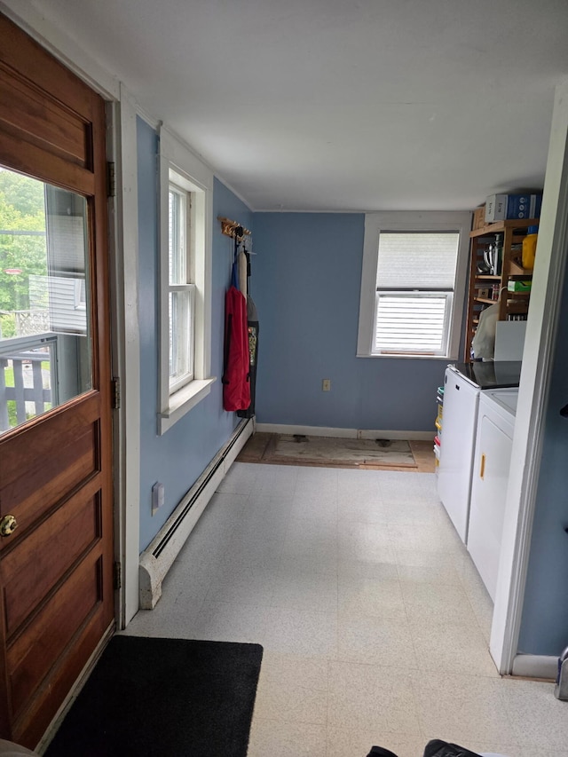 21 Wilson St, Eastport, ME 04631 - washroom featuring a baseboard heating unit and washing machine and clothes dryer