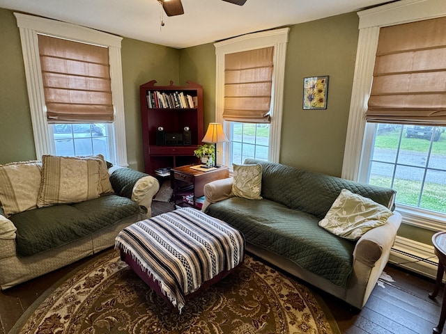 21 Wilson St, Eastport, ME 04631 - living area featuring wood-type flooring, plenty of natural light, and a ceiling fan