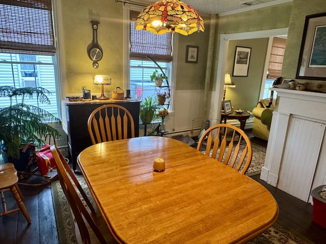 21 Wilson St, Eastport, ME 04631 - dining space featuring wood-type flooring, plenty of natural light, and wainscoting