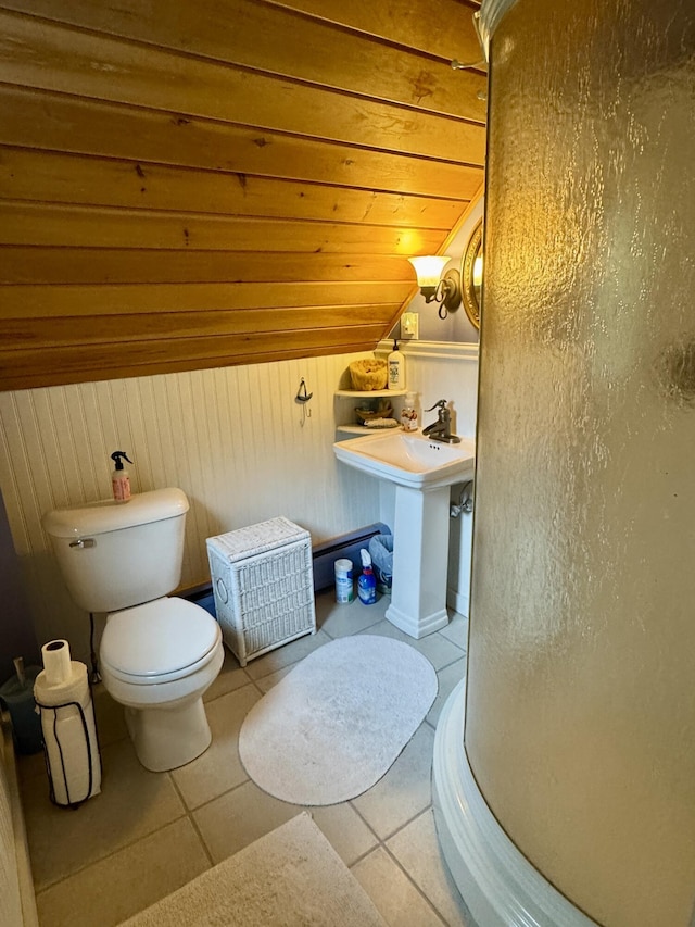21 Wilson St, Eastport, ME 04631 - bathroom featuring vaulted ceiling, wood ceiling, wooden walls, and tile patterned flooring