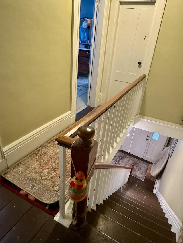 21 Wilson St, Eastport, ME 04631 - stairway with hardwood / wood-style flooring and baseboards