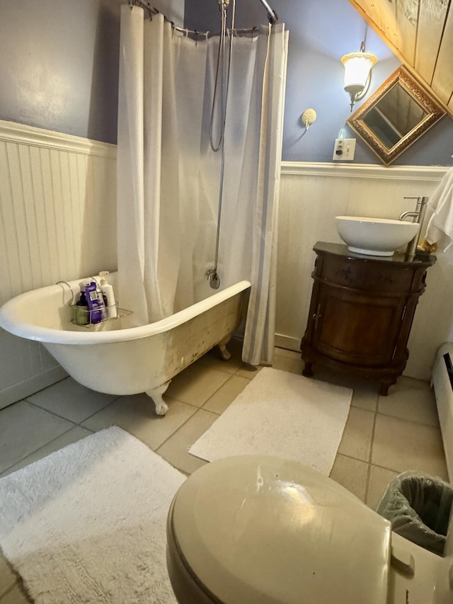 21 Wilson St, Eastport, ME 04631 - full bathroom with a wainscoted wall, tile patterned flooring, and vanity