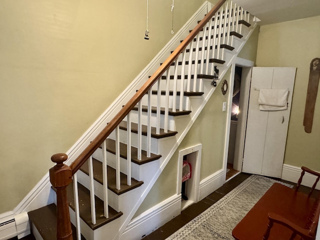 21 Wilson St, Eastport, ME 04631 - stairway with a baseboard radiator and baseboards