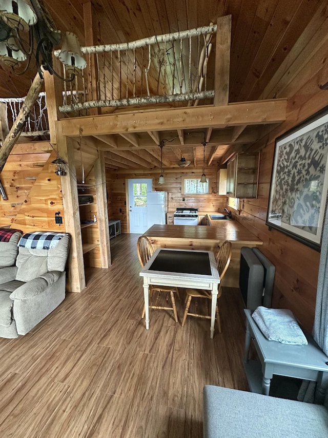 322 Lamb Rd, Roxbury, ME 04275 - living area featuring wood walls, wood finished floors, and a wooden ceiling with exposed beams