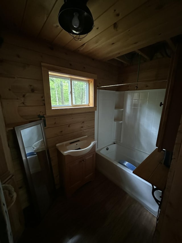322 Lamb Rd, Roxbury, ME 04275 - bathroom featuring wooden walls, wood finished floors, bathing tub / shower combination, and wood ceiling