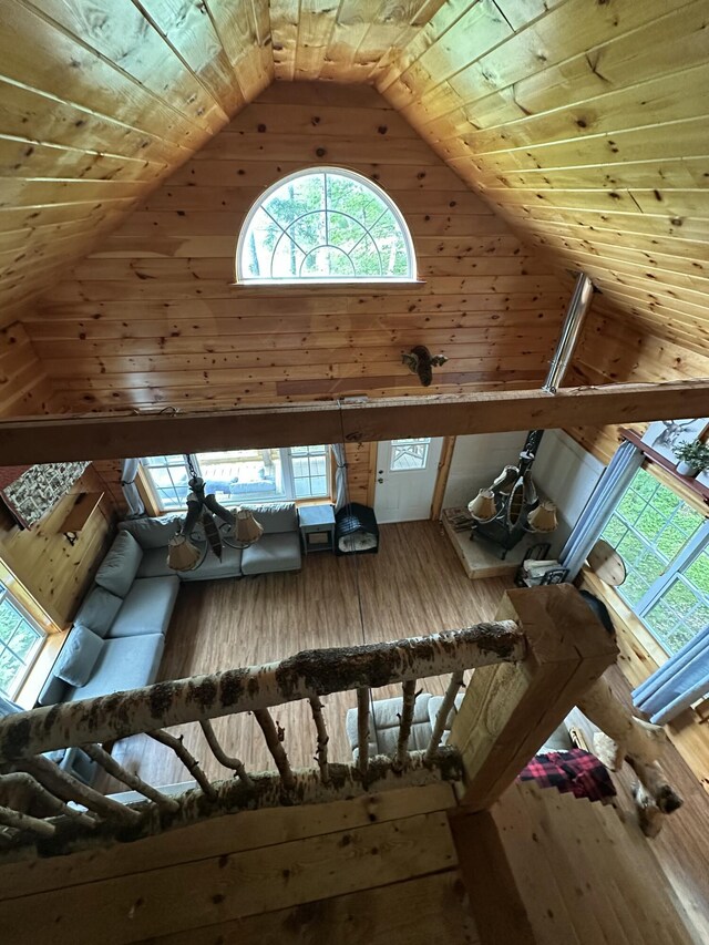 322 Lamb Rd, Roxbury, ME 04275 - living room with high vaulted ceiling, wood ceiling, hardwood / wood-style floors, and wooden walls