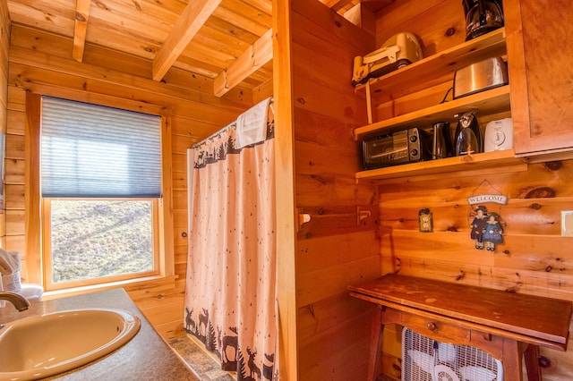 49 Winston Rd, Rangeley, ME 04970 - bathroom featuring wood walls, a wood ceiling with exposed beams, vanity, and a shower with curtain