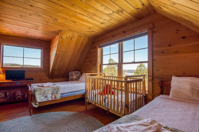 49 Winston Rd, Rangeley, ME 04970 - bedroom with wooden walls, lofted ceiling, hardwood / wood-style flooring, and wood ceiling