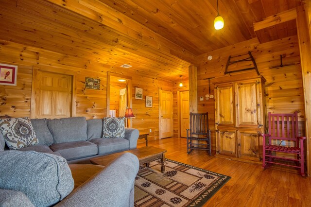 49 Winston Rd, Rangeley, ME 04970 - living area with light wood-type flooring, wooden walls, and wood ceiling