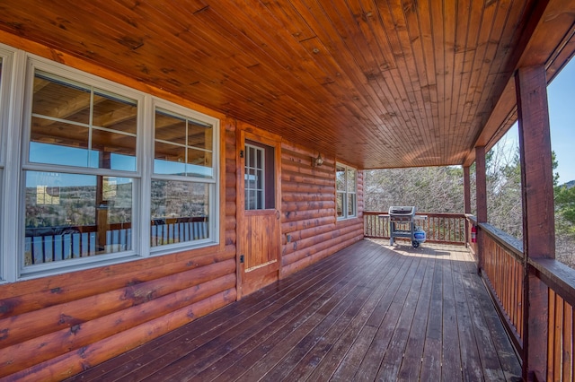 49 Winston Rd, Rangeley, ME 04970 - wooden porch with grilling area