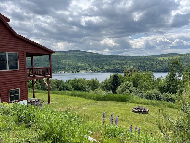 49 Winston Rd, Rangeley, ME 04970 - view of mountain background featuring a heavily wooded area and a large body of water