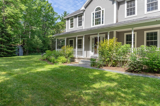 34 Perk Orock Landing Rd, Orono, ME 04473 - view of front of property with a porch and a front lawn