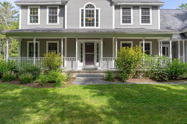 34 Perk Orock Landing Rd, Orono, ME 04473 - colonial inspired home with covered porch, a front yard, and a shingled roof