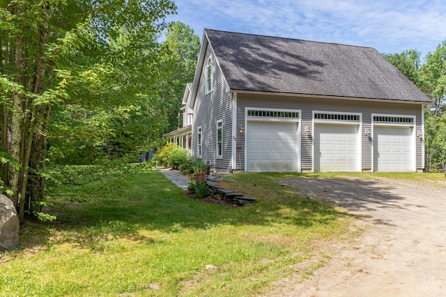 34 Perk Orock Landing Rd, Orono, ME 04473 - view of home's exterior featuring roof with shingles, a garage, and a lawn