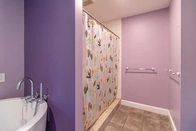 34 Perk Orock Landing Rd, Orono, ME 04473 - full bath with a tile shower, a freestanding bath, and tile patterned floors