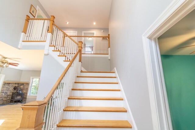 34 Perk Orock Landing Rd, Orono, ME 04473 - stairs with a ceiling fan, a wood stove, wood finished floors, and recessed lighting