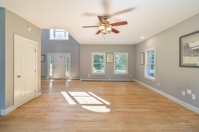 34 Perk Orock Landing Rd, Orono, ME 04473 - foyer featuring baseboard heating, ceiling fan, a baseboard heating unit, and light wood-type flooring