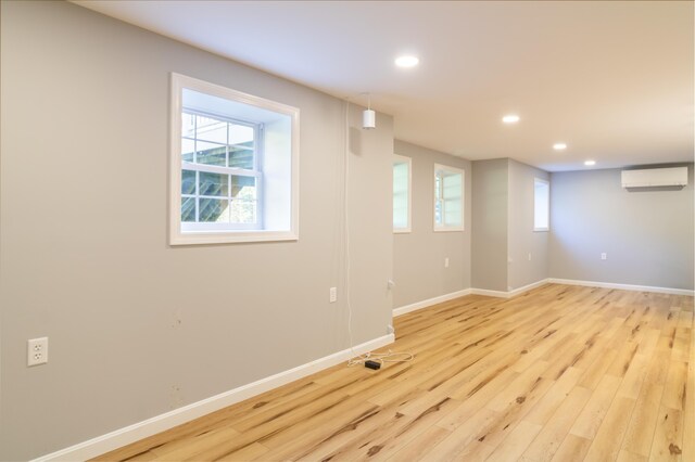 34 Perk Orock Landing Rd, Orono, ME 04473 - basement with a wall mounted AC, recessed lighting, and light wood-style flooring