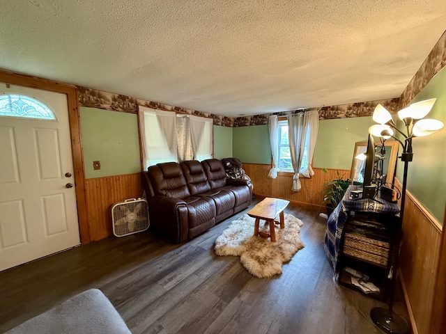 1897 Pequawket Trl, Hiram, ME 04041 - living area with wainscoting, wooden walls, a textured ceiling, and wood finished floors