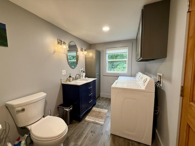 1897 Pequawket Trl, Hiram, ME 04041 - bathroom featuring independent washer and dryer, vanity, wood finished floors, and recessed lighting