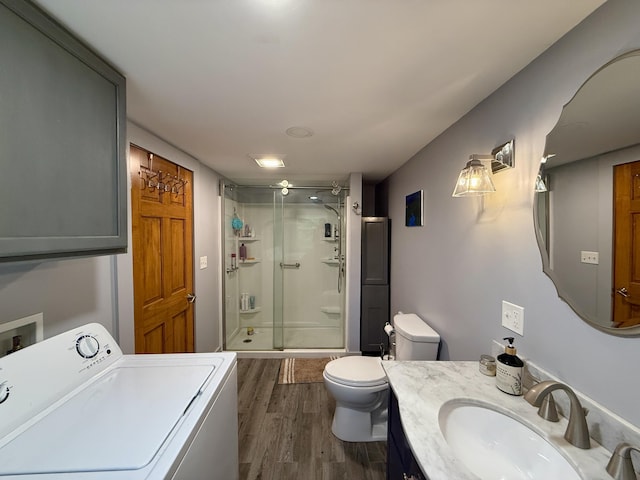 1897 Pequawket Trl, Hiram, ME 04041 - bathroom with washer / dryer, a shower stall, wood finished floors, and vanity