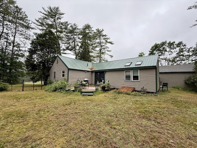 1897 Pequawket Trl, Hiram, ME 04041 - rear view of property with a lawn, a deck, and a metal roof