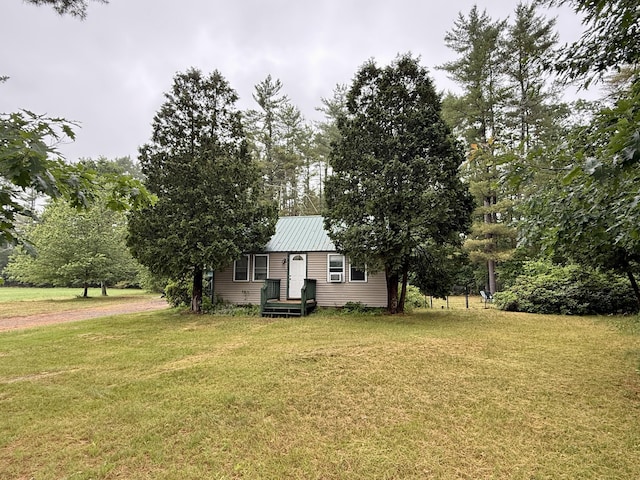 1897 Pequawket Trl, Hiram, ME 04041 - view of front of house with a front yard and a metal roof