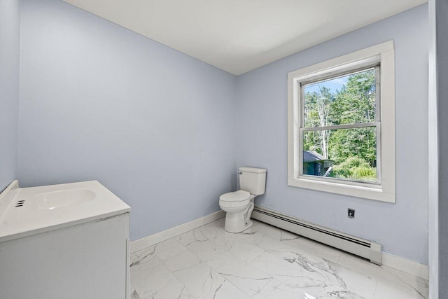 27 Bradford Rd, Wiscasset, ME 04578 - half bathroom with a baseboard radiator, marble look tiles, and vanity