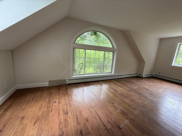 27 Bradford Rd, Wiscasset, ME 04578 - bonus room with vaulted ceiling, hardwood / wood-style floors, and baseboard heating