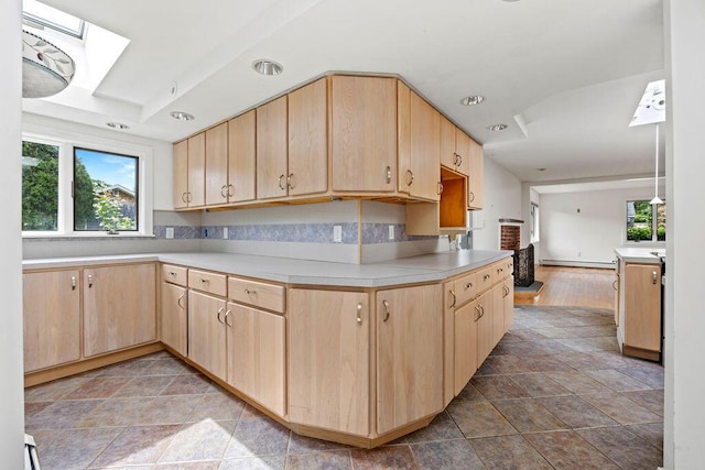 13 Community House Rd, Kennebunkport, ME 04046 - kitchen with light brown cabinets, light countertops, a baseboard radiator, a skylight, and recessed lighting