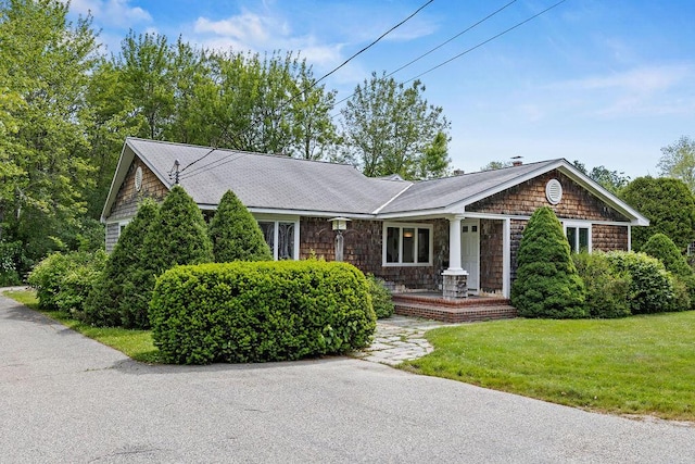 13 Community House Rd, Kennebunkport, ME 04046 - view of front of property with a front yard, a porch, and a shingled roof