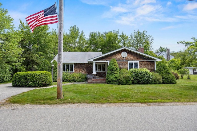 13 Community House Rd, Kennebunkport, ME 04046 - view of front of home with a front lawn and a chimney