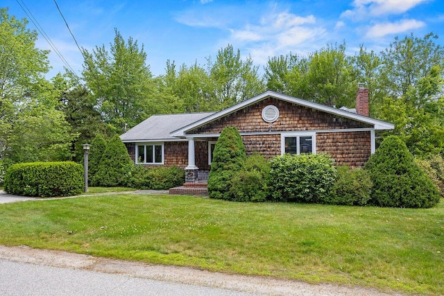 13 Community House Rd, Kennebunkport, ME 04046 - view of front of house with a chimney and a front lawn