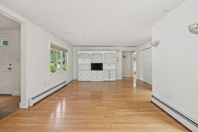 13 Community House Rd, Kennebunkport, ME 04046 - unfurnished living room with a baseboard radiator and light wood finished floors