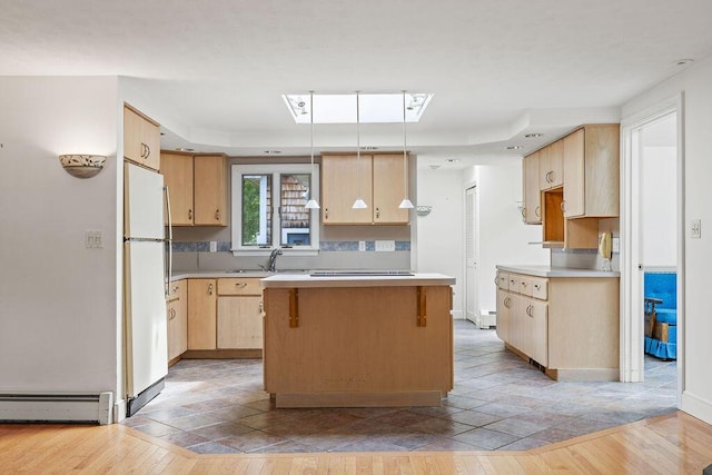 13 Community House Rd, Kennebunkport, ME 04046 - kitchen featuring freestanding refrigerator, baseboard heating, light brown cabinetry, light countertops, and a kitchen island