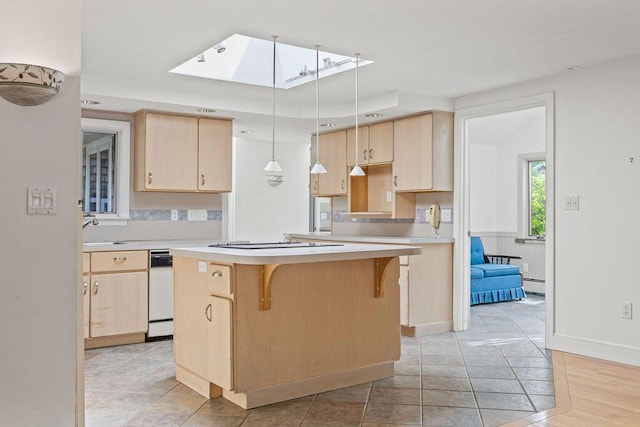 13 Community House Rd, Kennebunkport, ME 04046 - kitchen featuring light brown cabinets, light countertops, electric cooktop, and a skylight