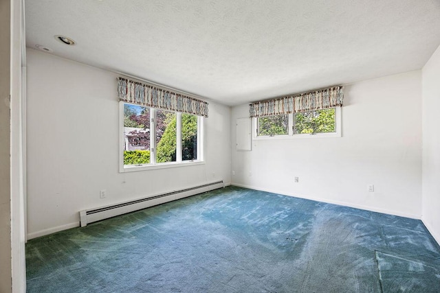 13 Community House Rd, Kennebunkport, ME 04046 - unfurnished room featuring baseboard heating, carpet, and a textured ceiling