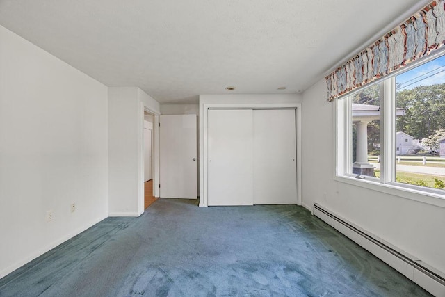 13 Community House Rd, Kennebunkport, ME 04046 - unfurnished bedroom with a baseboard radiator, carpet, and a closet
