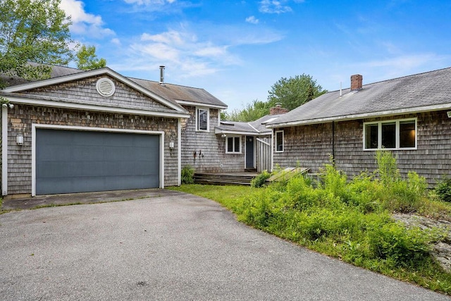 13 Community House Rd, Kennebunkport, ME 04046 - view of front of property featuring a chimney, asphalt driveway, and an attached garage