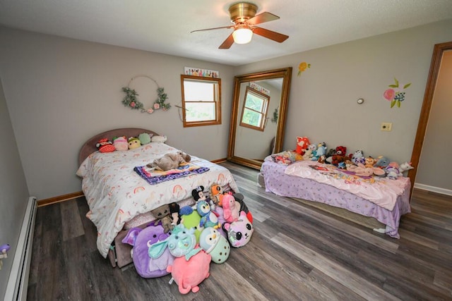 13 Evergreen Dr, Hampden, ME 04444 - bedroom featuring a baseboard heating unit, wood finished floors, and a ceiling fan