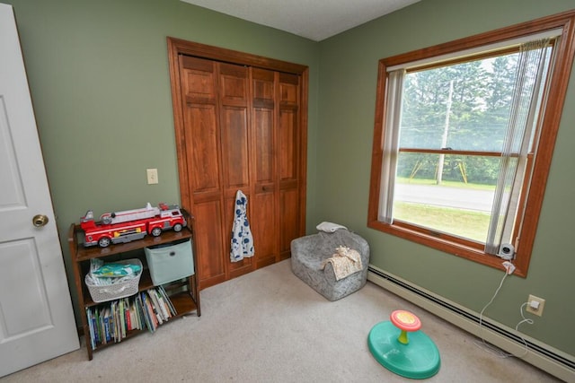 13 Evergreen Dr, Hampden, ME 04444 - bedroom featuring a baseboard radiator, carpet flooring, and a closet